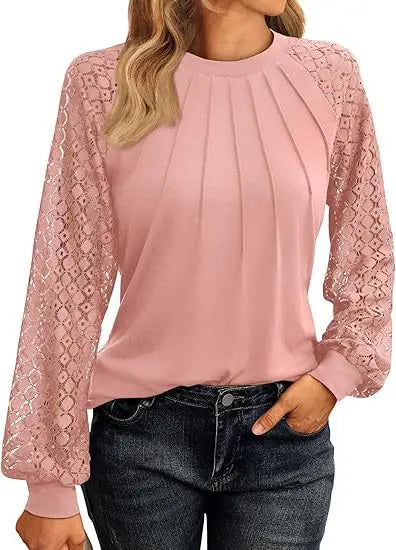 Pink pullover blouse with pintuck pleats and lace sleeves, styled front view