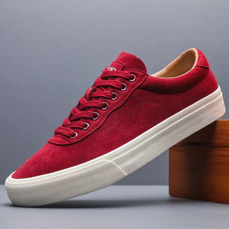 Red suede low top sneaker side profile with white outsole