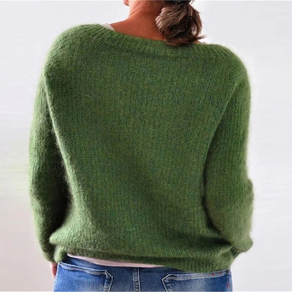Woman wearing green ribbed knit sweater, back view