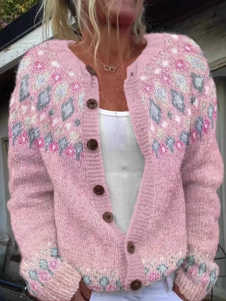 Pink knit cardigan with floral patterned yoke