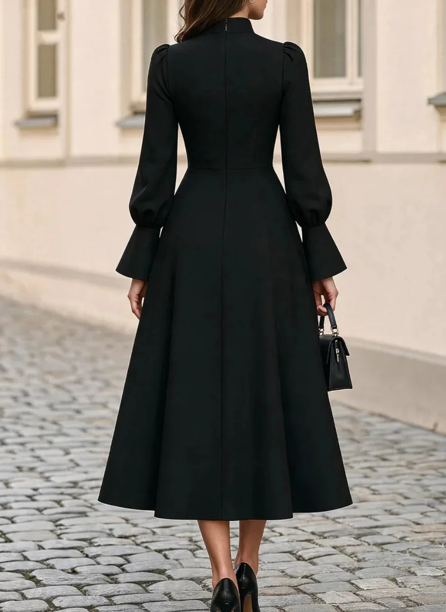 Black midi dress, back view showing zip closure