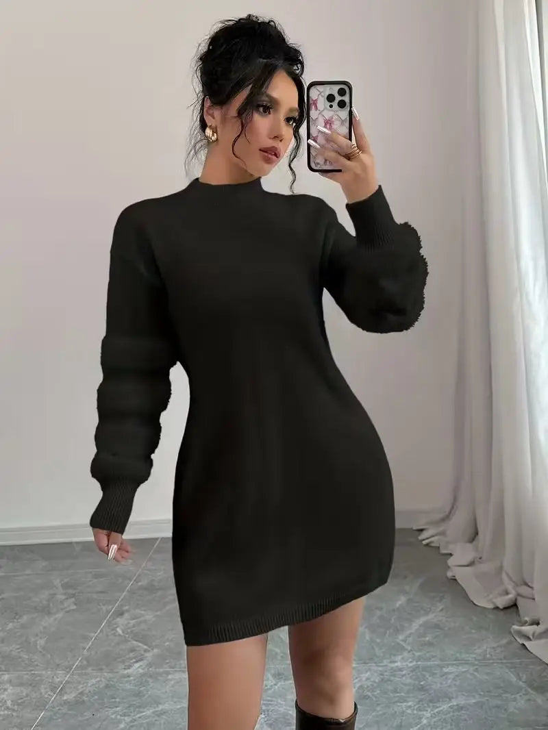 Black mock neck sweater dress with textured sleeve panels