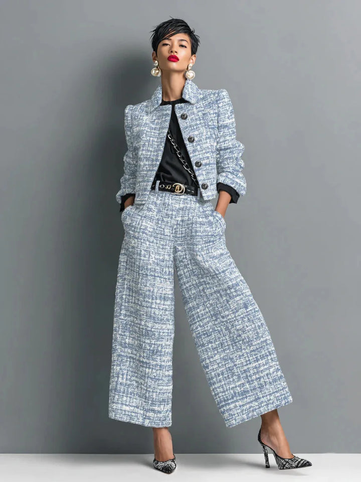 Woman wearing light blue tweed jacket and wide leg pants set, front view