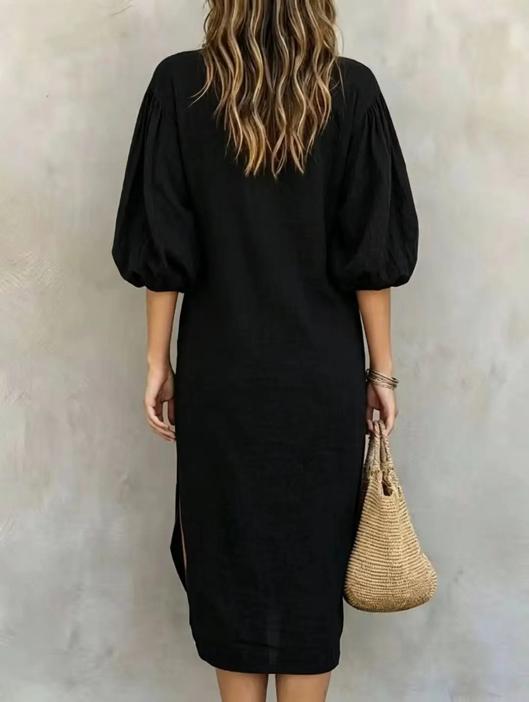 Back view of black mock neck midi dress with balloon sleeves