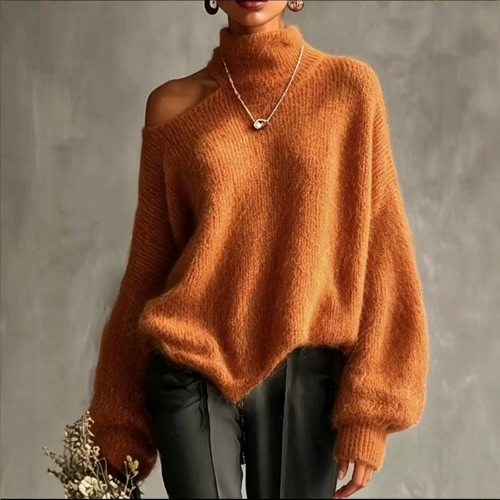 Woman wearing orange cutout shoulder turtleneck sweater