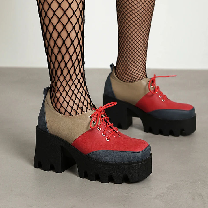 Red, taupe, and navy color block platform shoe with fishnet tights