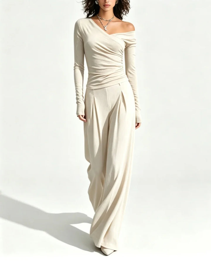 Woman wearing apricot off shoulder top and wide leg pant set