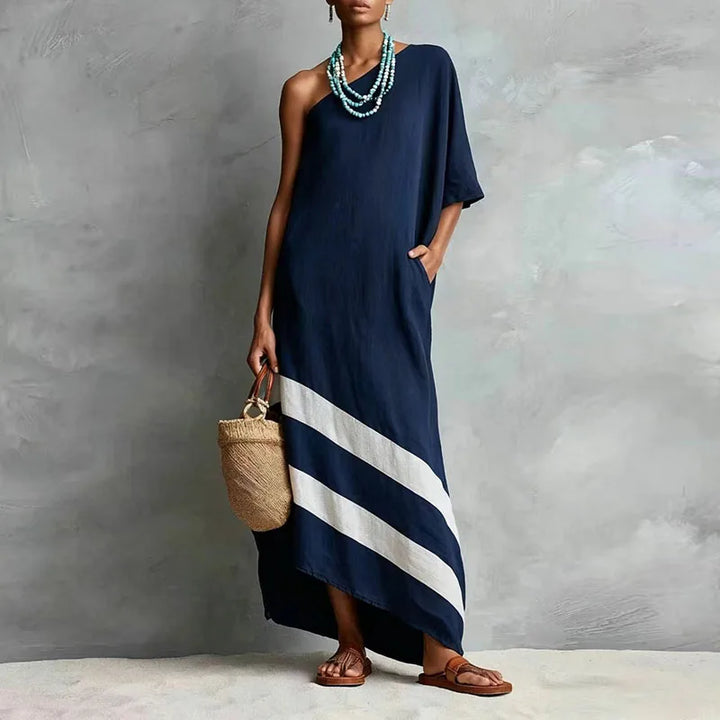 Navy blue one-shoulder maxi dress with diagonal stripe hem