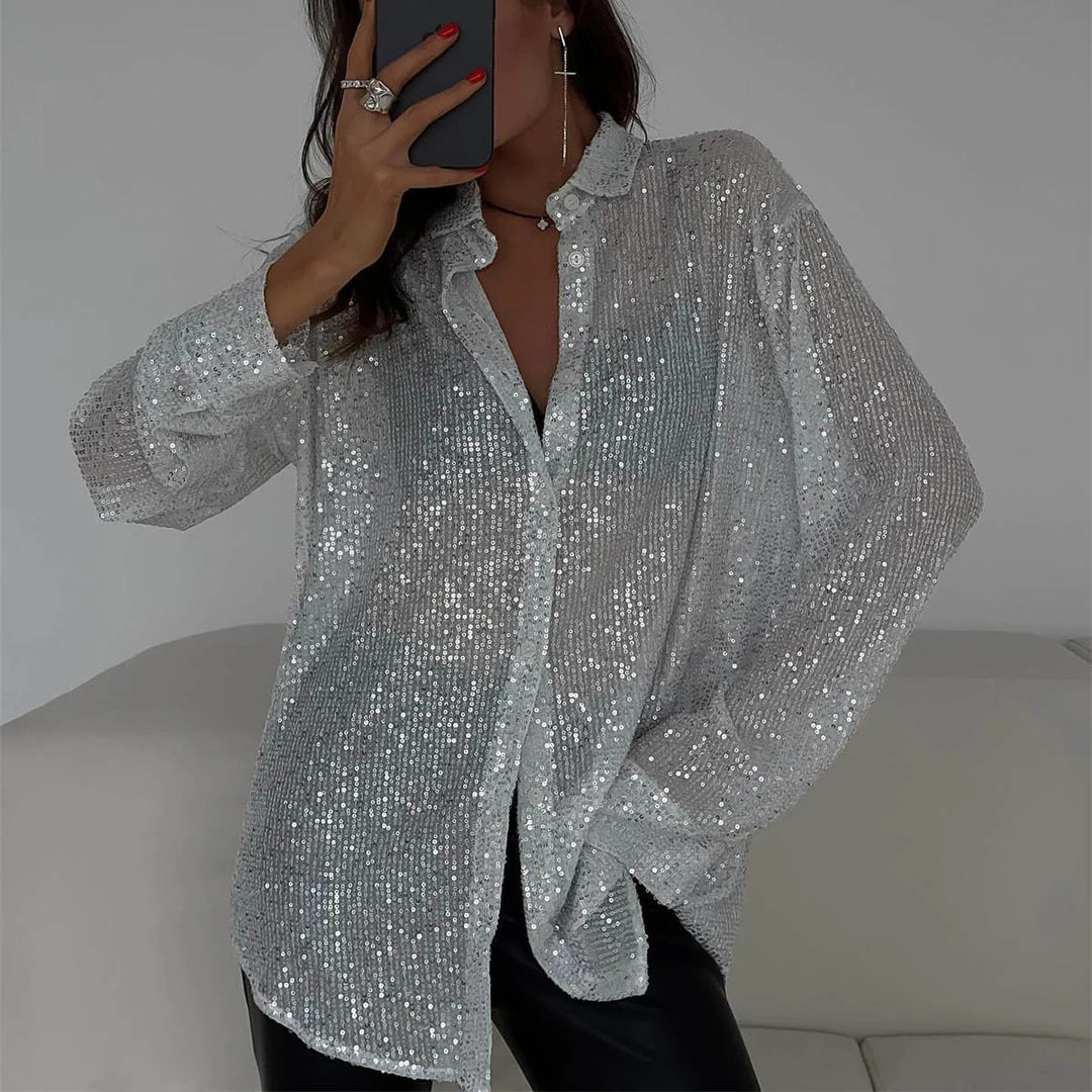 Woman wearing silver sequin button-front shirt with black leather pants