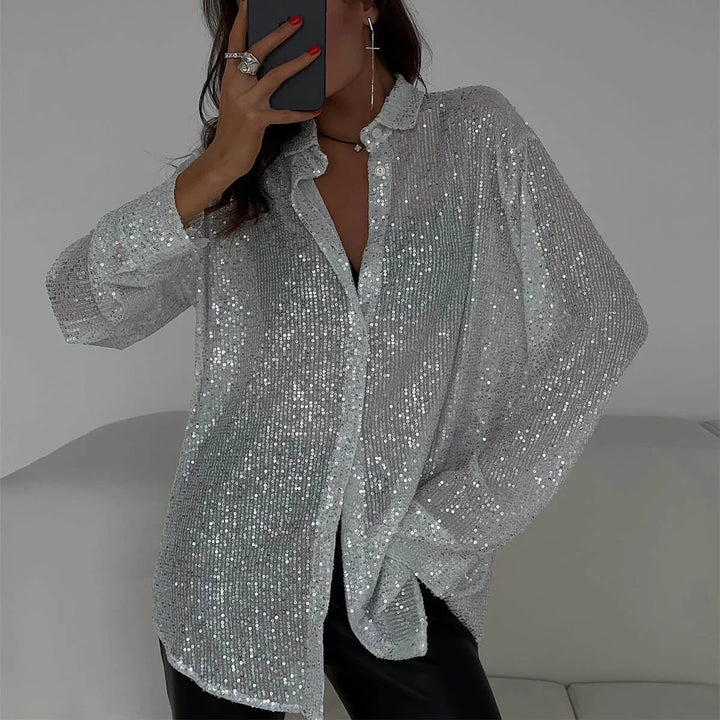 Woman wearing silver sequin button-front shirt with black leather pants