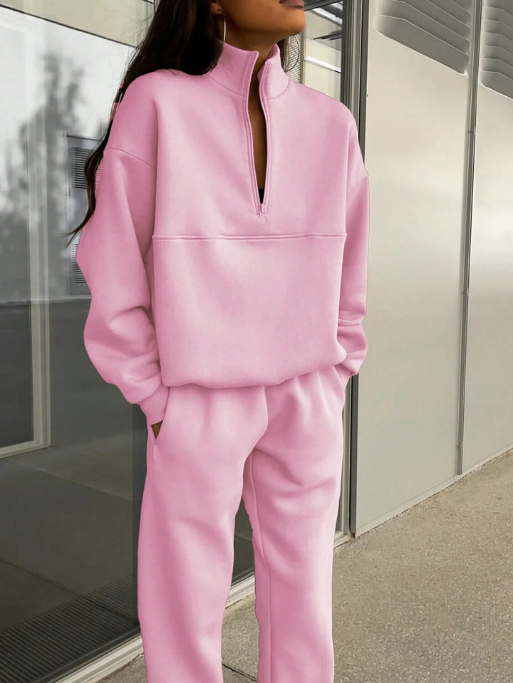 Close up of pink half-zip collar and zipper detail