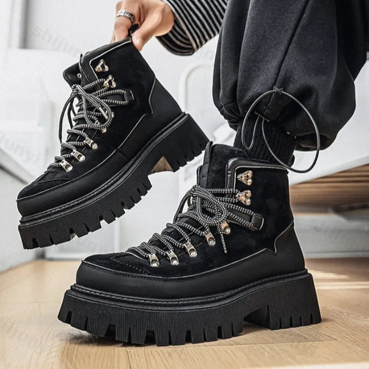 Black platform hiking boots on model close up