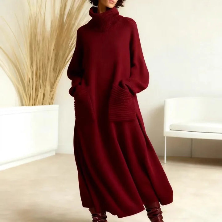 Woman wearing red turtleneck sweater dress with pockets, full length