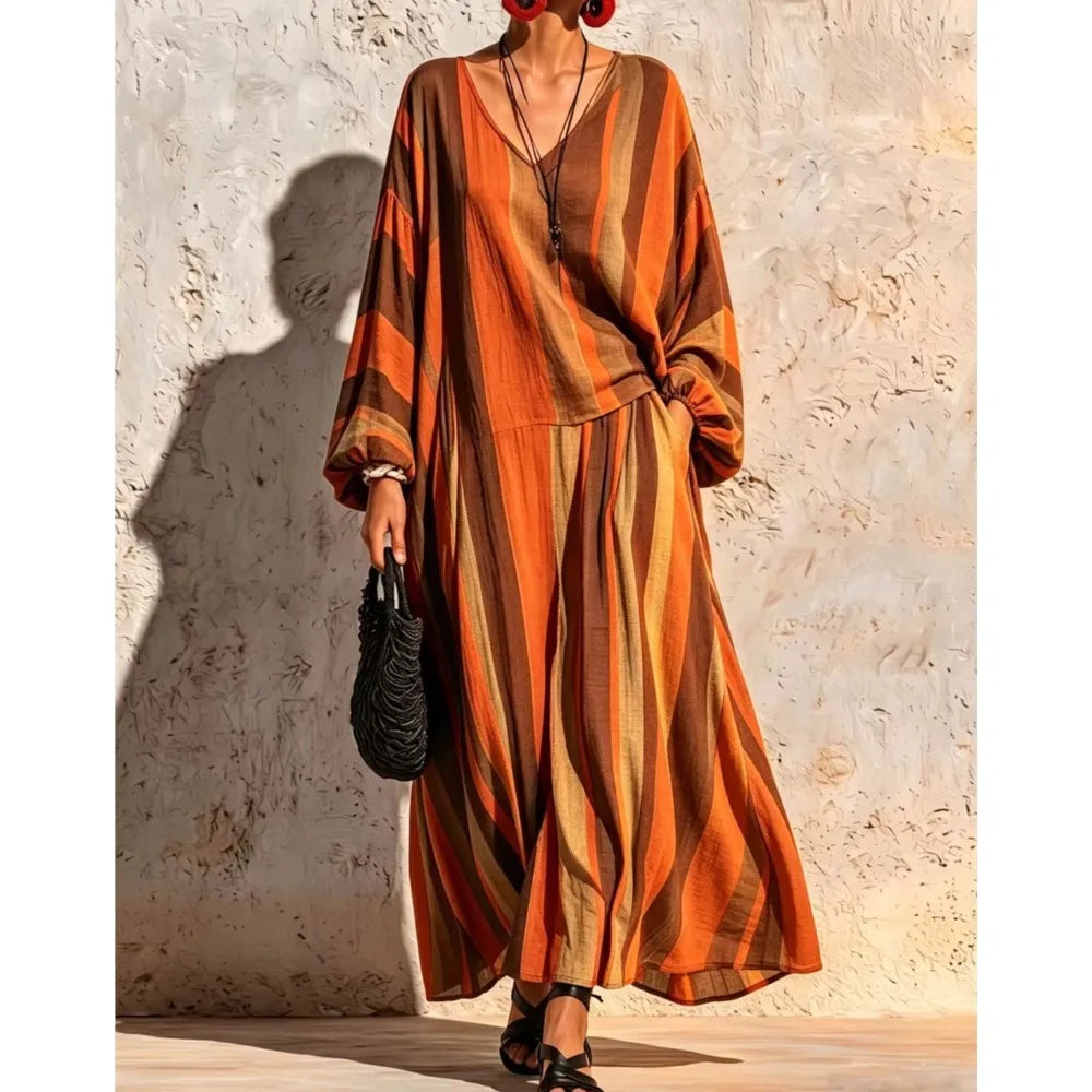 Woman wearing orange and brown striped V-neck top and wide leg pants set