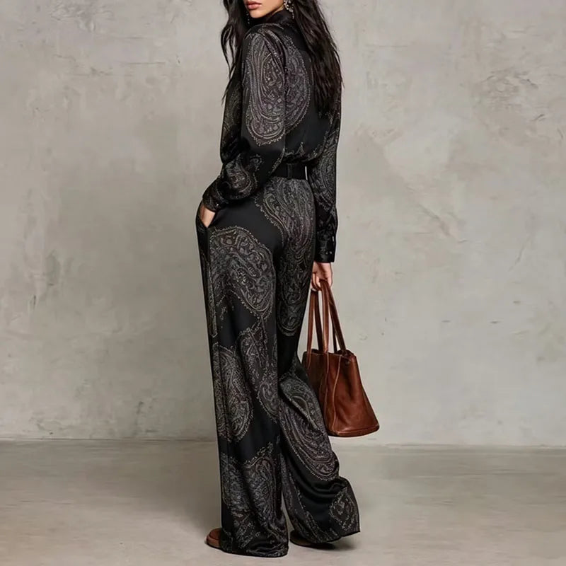 Back view of black paisley print two-piece shirt and wide leg pants set