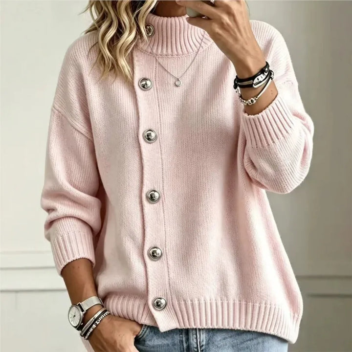 Woman wearing pink button front mock turtleneck sweater
