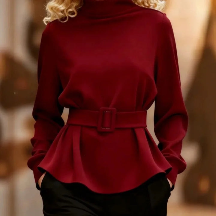 Red belted peplum top with mock neckline, close front view