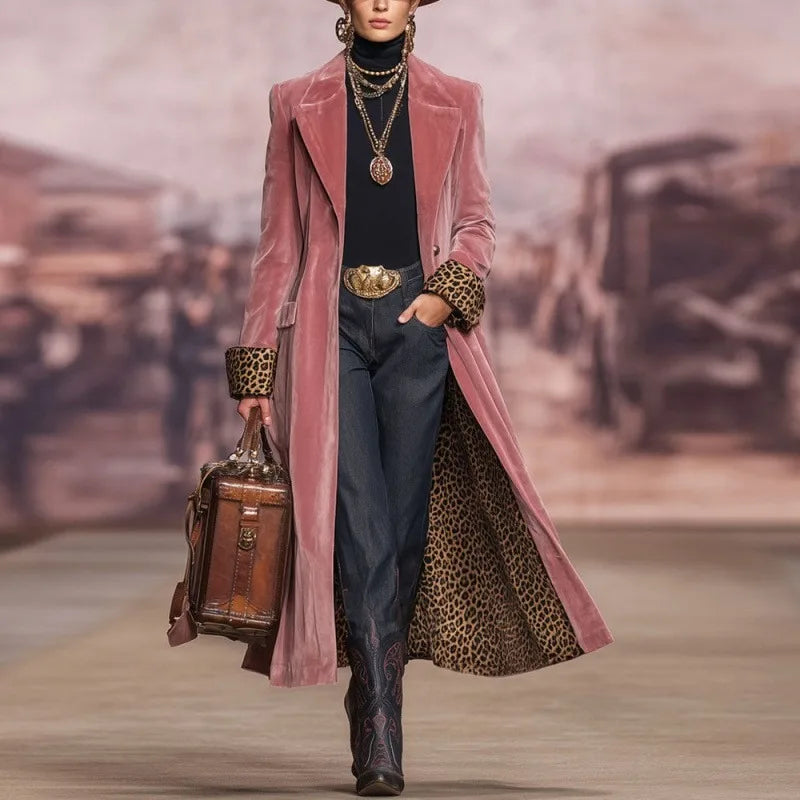 Woman in pink velvet long trench coat with leopard lining, front view