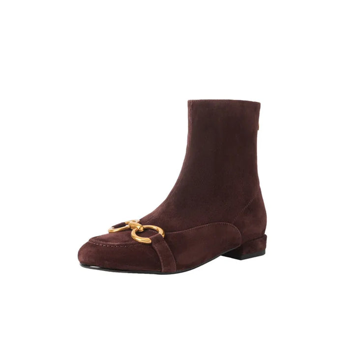 Brown suede ankle boot with gold horsebit buckle, angled view