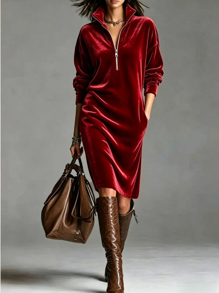 Woman in red velvet half-zip midi dress with brown boots