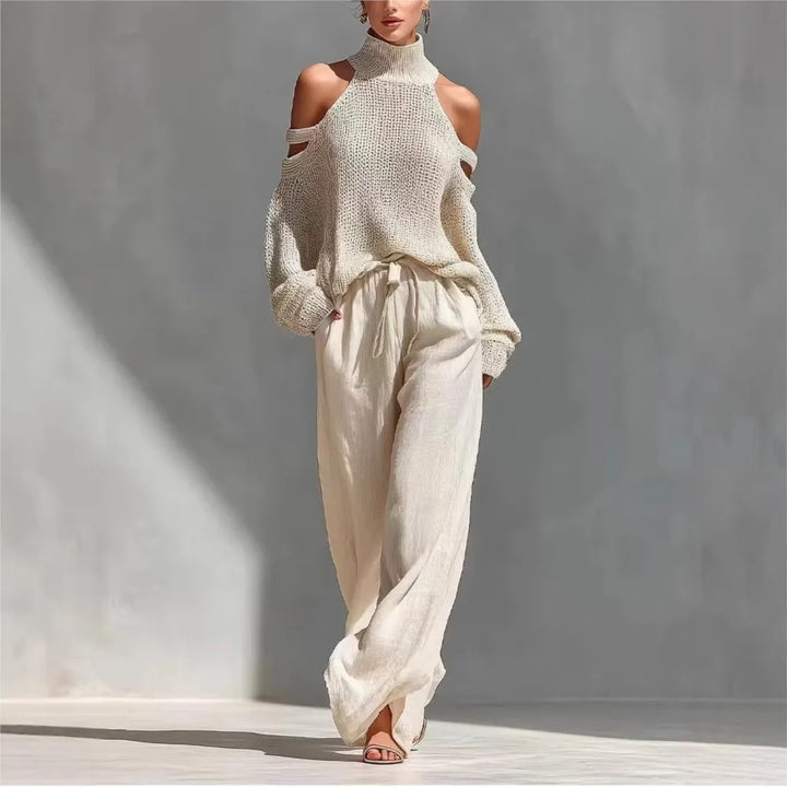 Woman wearing beige cutout shoulder sweater and wide leg pant set, front view