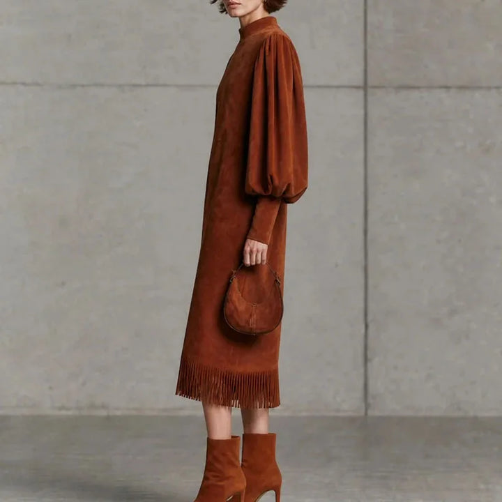 Side profile of brown velvet lantern sleeve midi dress with fringe hem
