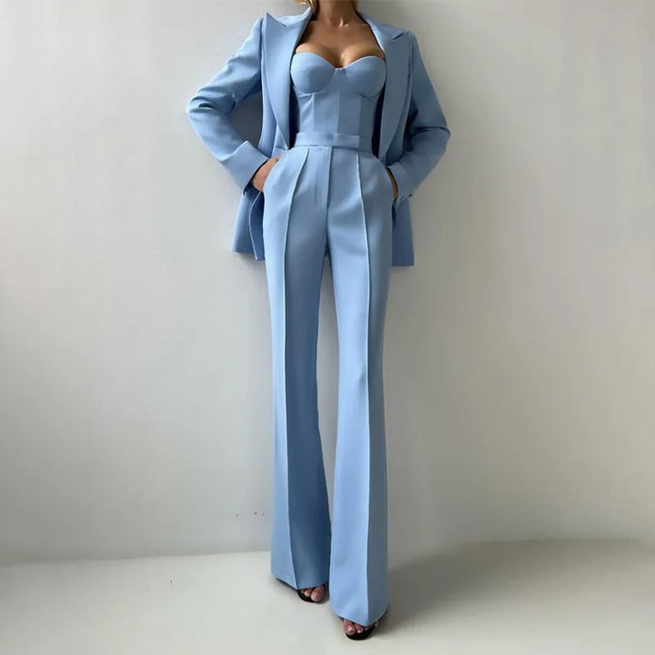 Light blue three piece suit with blazer, bustier top, and flared pants