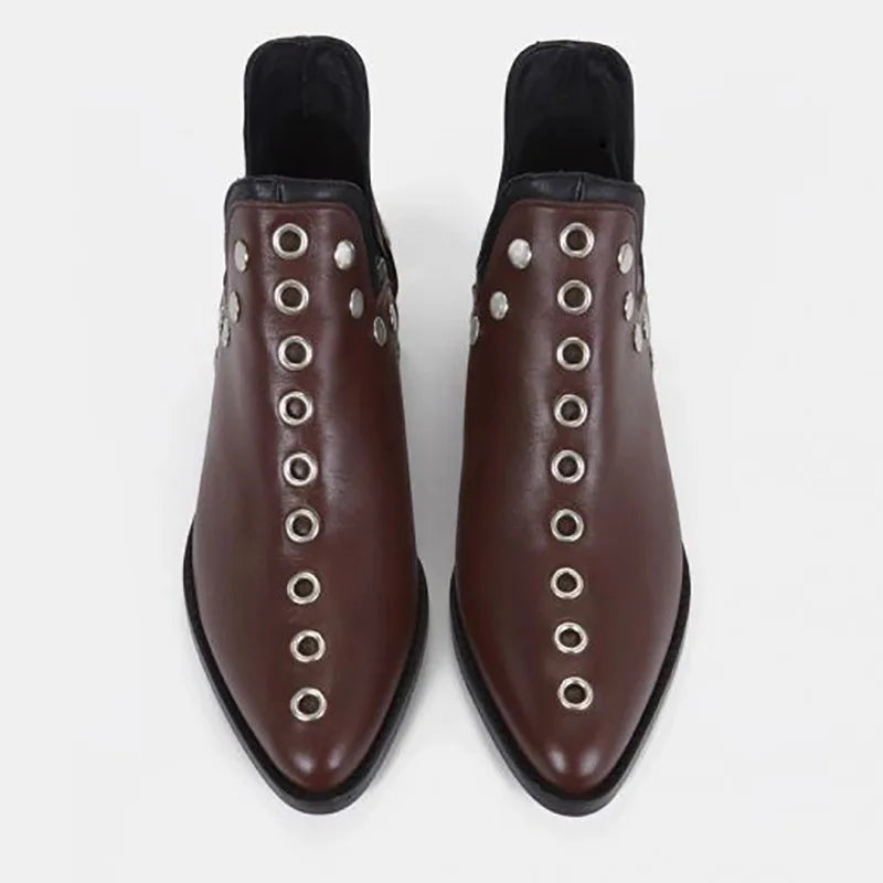 Top view of wine red leather ankle boots with grommet trim