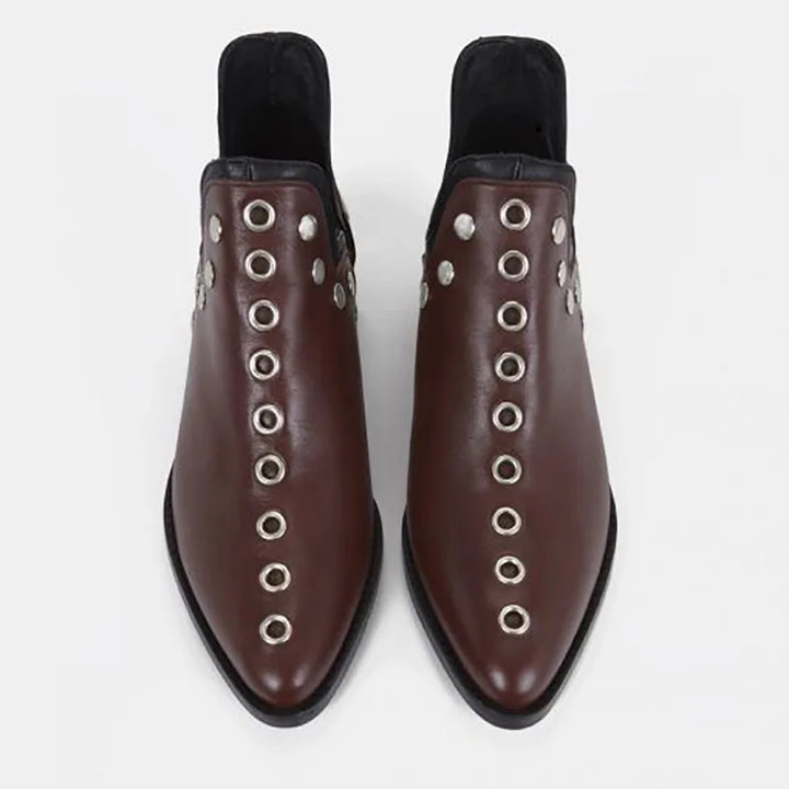 Top view of wine red leather ankle boots with grommet trim