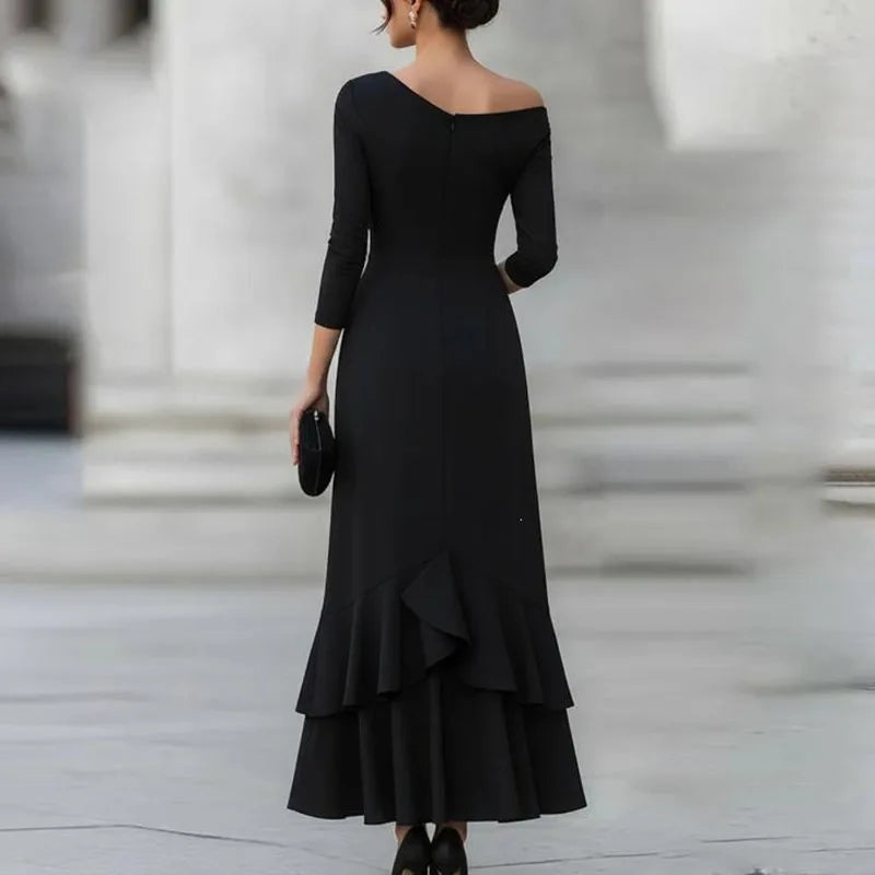 Black off-shoulder mermaid dress back view showing tiered ruffle hem
