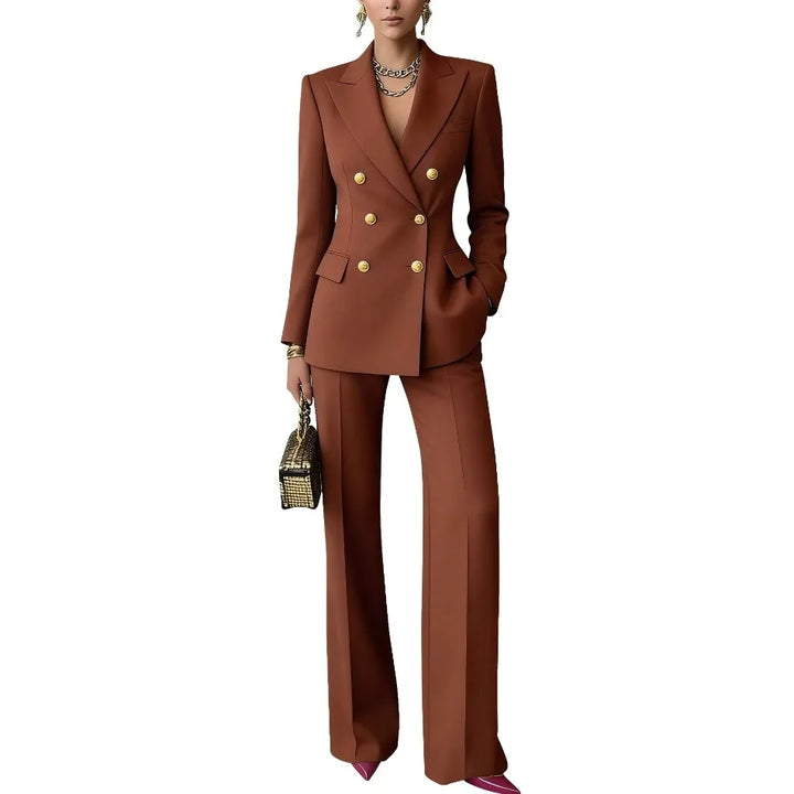 Woman wearing brown double-breasted blazer and wide leg pants suit, front view against plain background