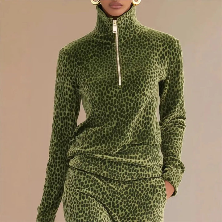 Close up of green leopard print half-zip stand collar top