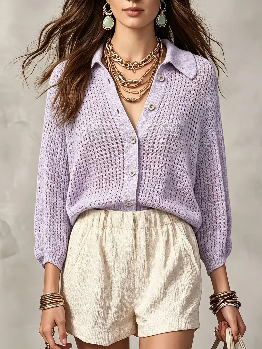 Woman wearing light purple open crochet knit cardigan with collar and buttons