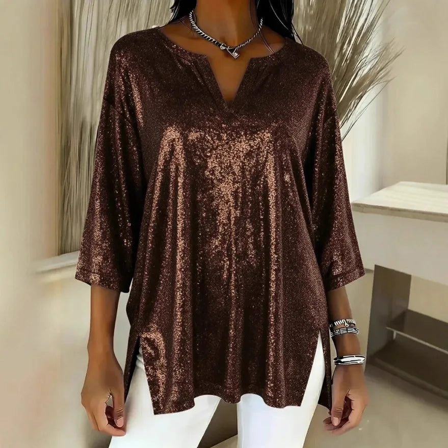 Woman wearing brown shimmer oversized blouse with V-neck