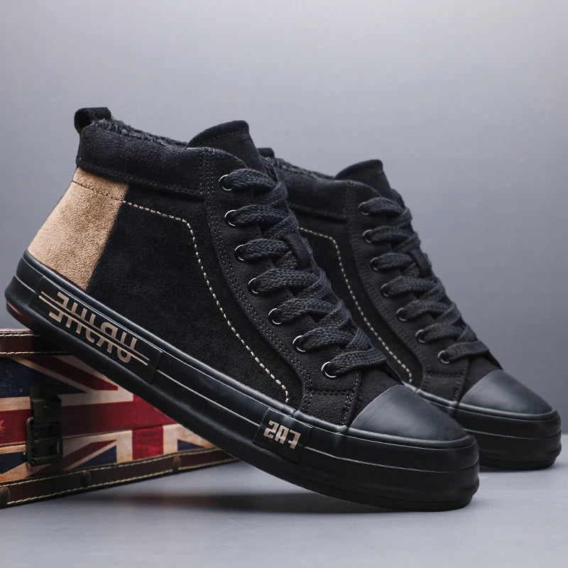 Pair of black high-top sneakers with tan panel