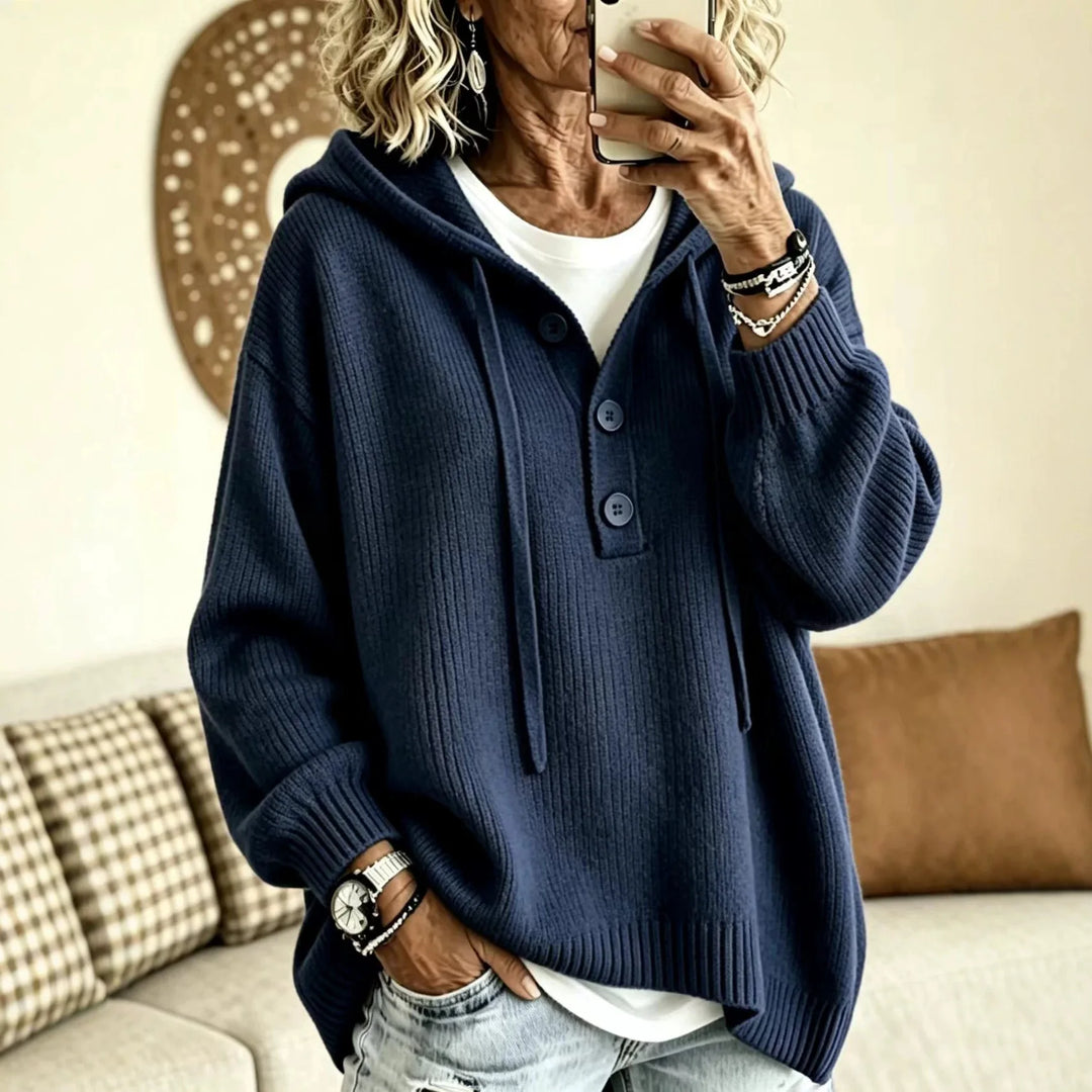Woman wearing navy ribbed knit hoodie with button placket