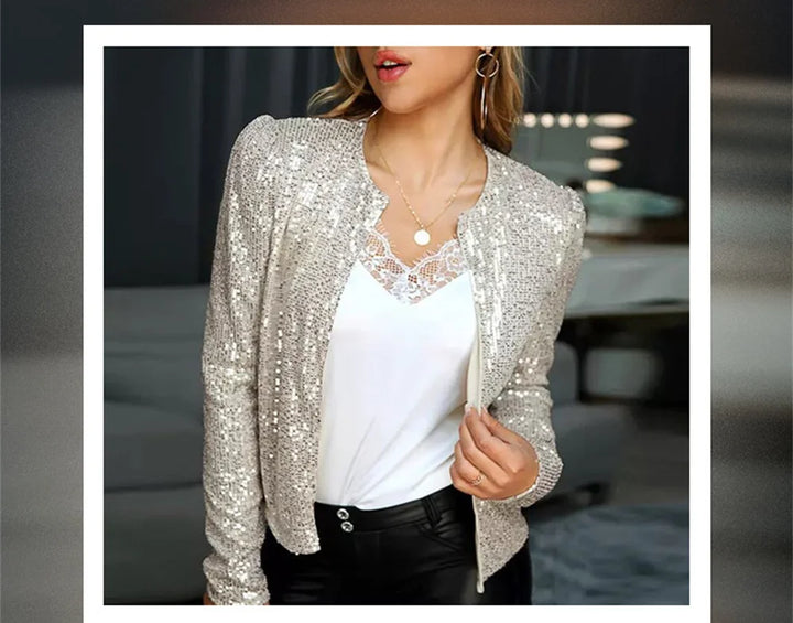 Woman wearing silver sequin jacket over lace cami