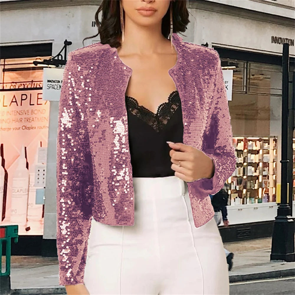Woman wearing lavender sequin jacket over black lace top on street