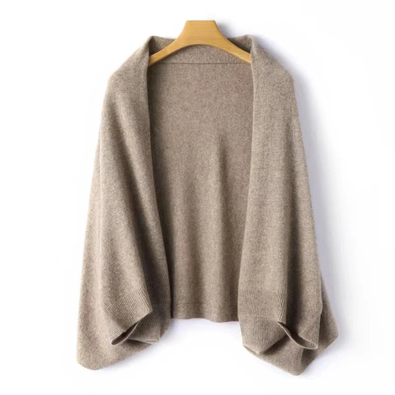 Taupe knit wrap shawl draped on hanger