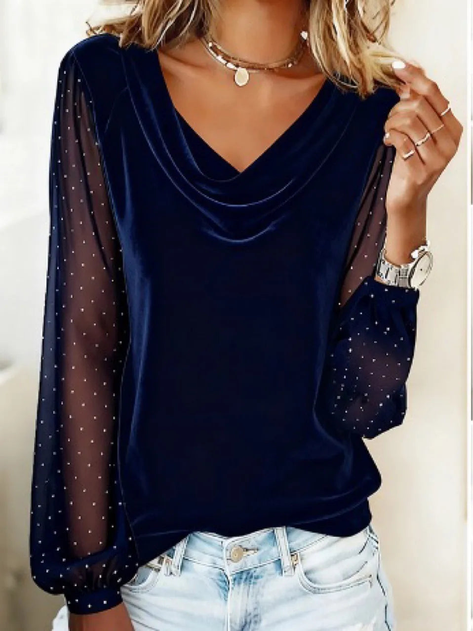 Navy blue velvet blouse with cowl neckline and sheer rhinestone mesh sleeves