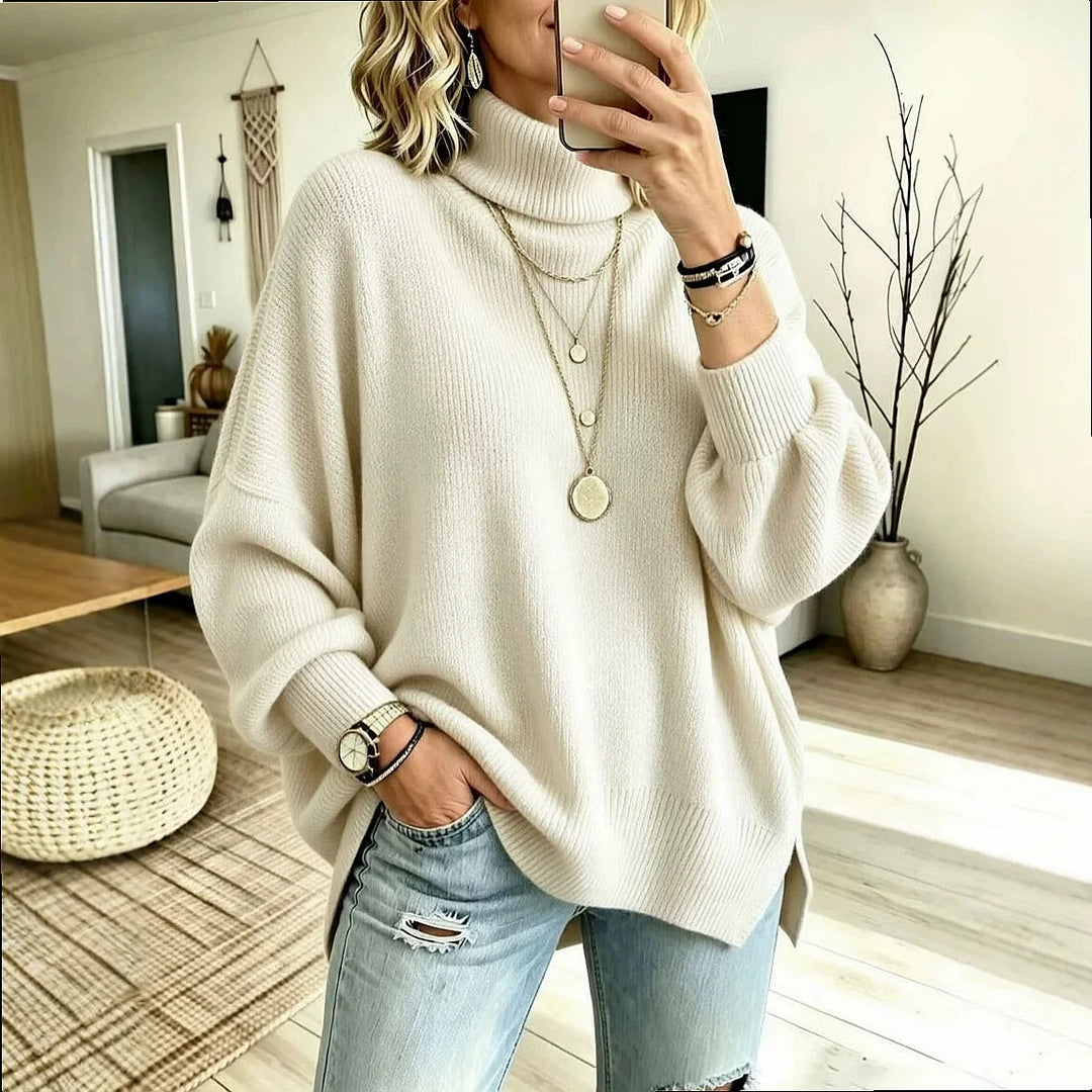 Woman wearing ivory oversized turtleneck sweater