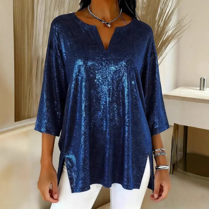 Woman wearing navy shimmer oversized blouse with V-neck