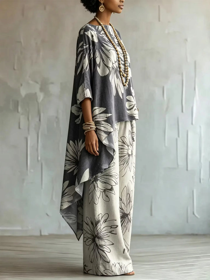 Side view of gray floral two-piece set with asymmetric top and wide leg pants