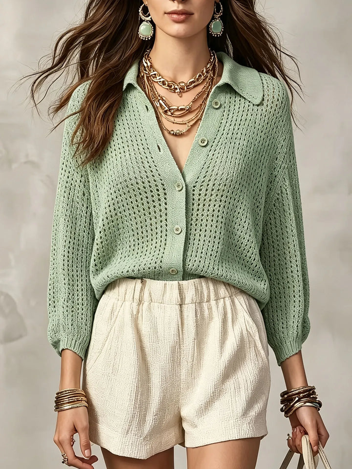 Woman wearing light green open crochet knit cardigan with collar and buttons