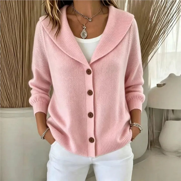Woman wearing pink shawl collar button front cardigan