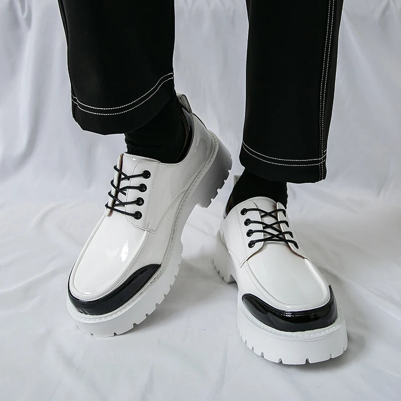 White patent Oxford shoes with black toe cap, side view