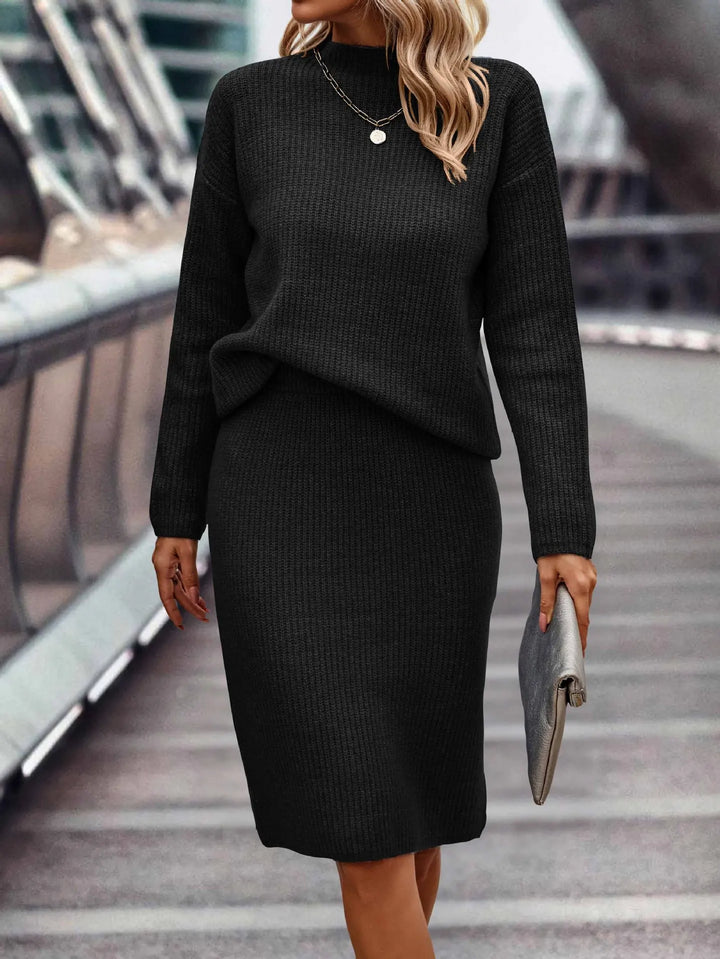 Close up of black ribbed knit sweater and skirt set