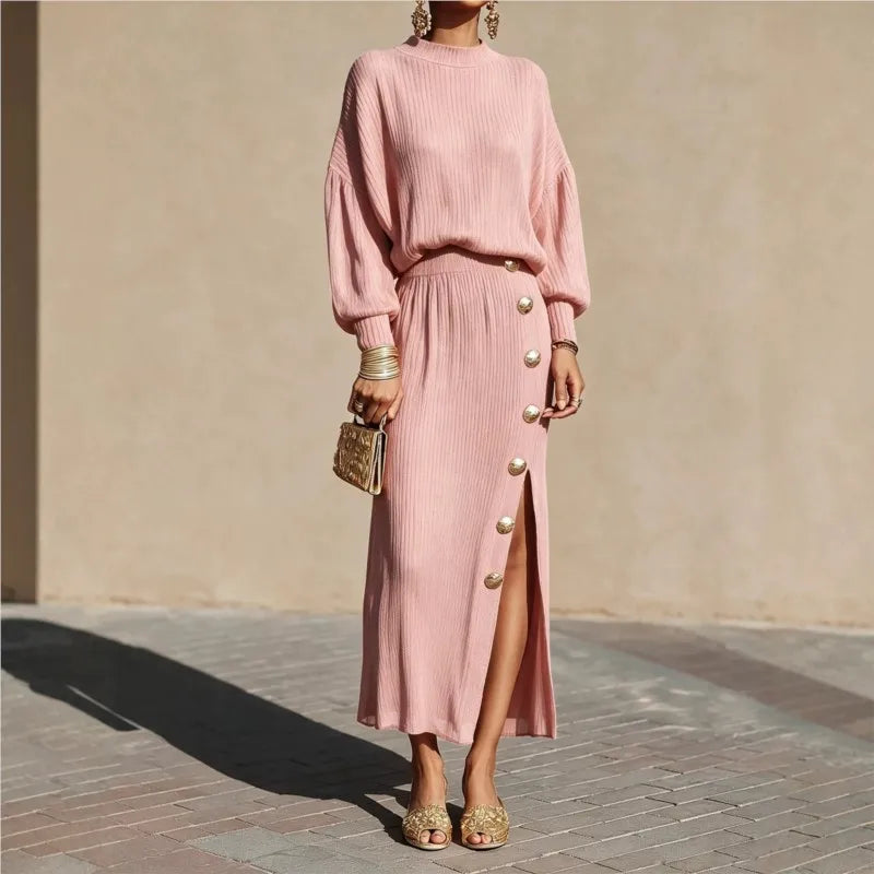 Woman in pink ribbed sweater dress with button side slit