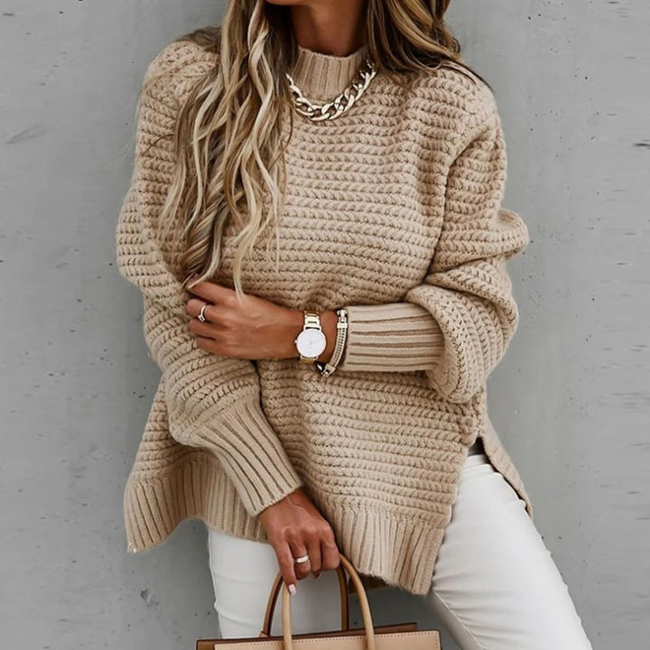 Woman wearing khaki chunky knit oversized sweater with mock neck