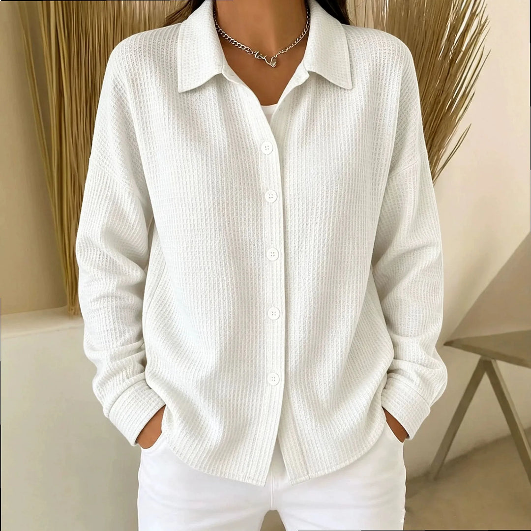 Woman wearing white waffle knit button-front shirt
